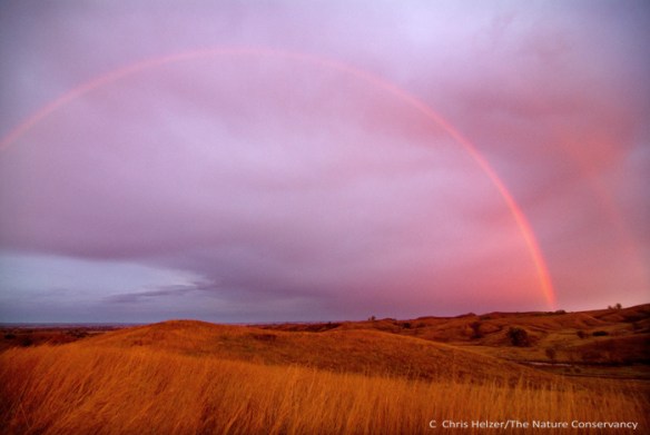 TNC's Broken Kettle Preserve in the Loess Hills of Iowa. Rainbow at sunrise.