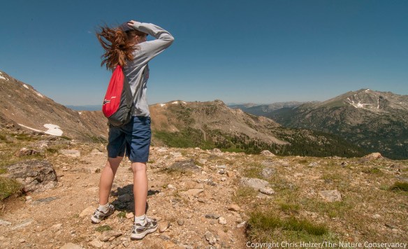 My daughter Anna had to hold on to her hat when we finally reached the top of the Pass.  The wind coming across the Continental Divide was enough to knock us over.
