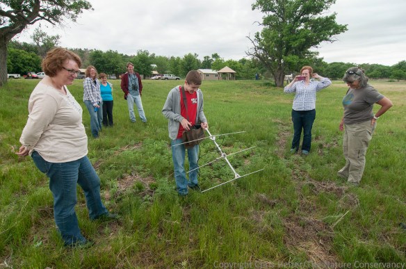 As he honed in on the transmitter hidden in the grass, John attracted a crowd of supporters.