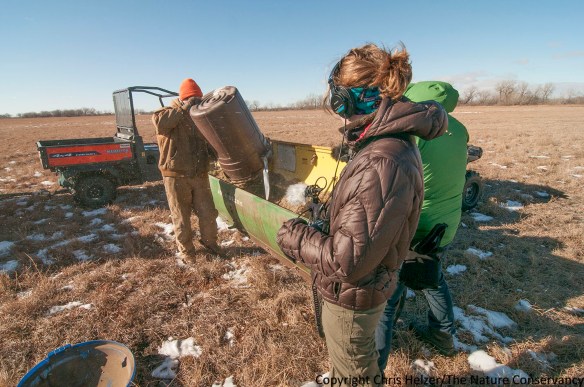 Ariana Brocious (with headphones) and Pete Stegen (green coat) collect audio and video footage as we prepare to overseed a degraded prairie back in January of this year.