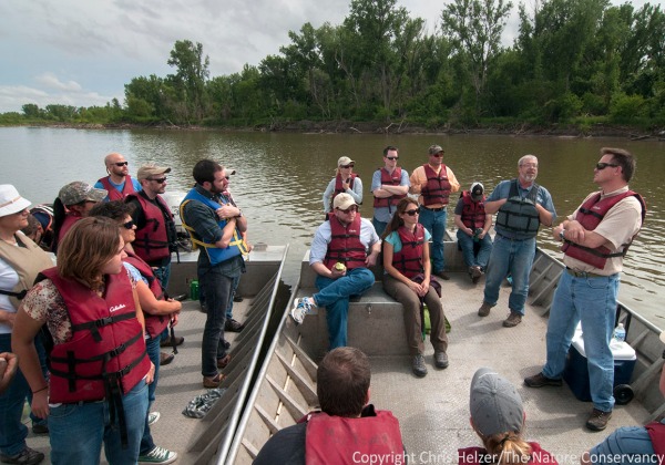 Kim Tri (bottom left) on a Missouri River boat tour in early June - part of a large conference of Nature Conservancy staff in Nebraska City.